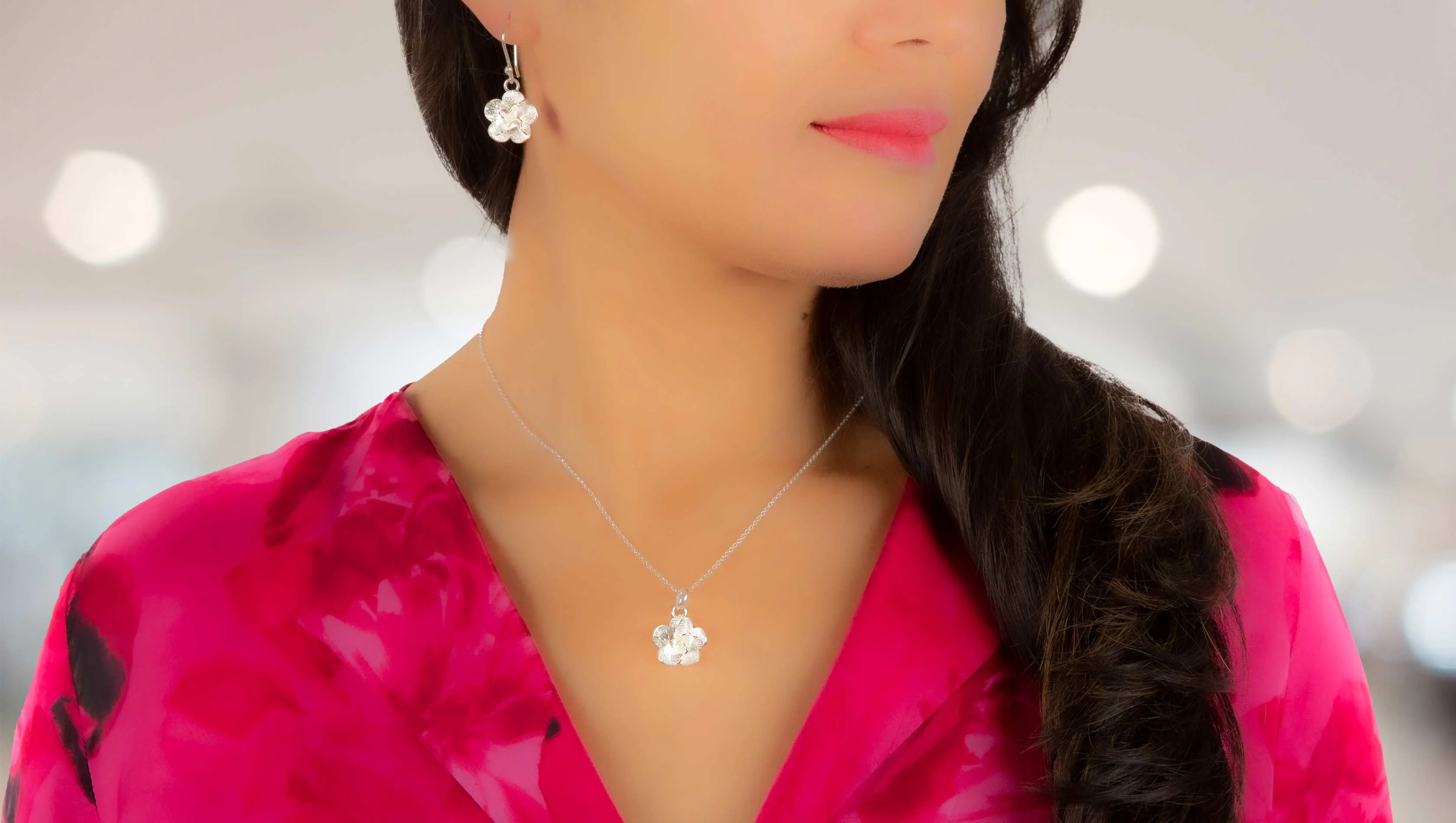 Woman with handmade silver jewelry